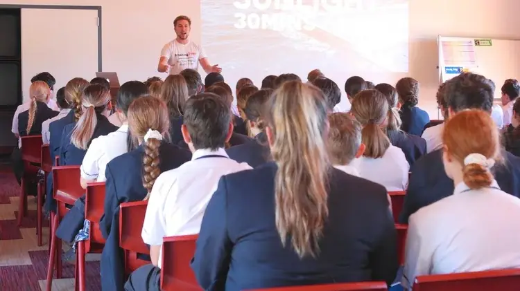 Sixth form students listening to James